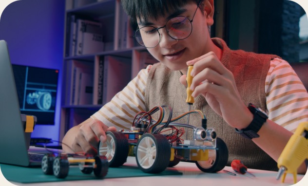 Young learner building a robotic car